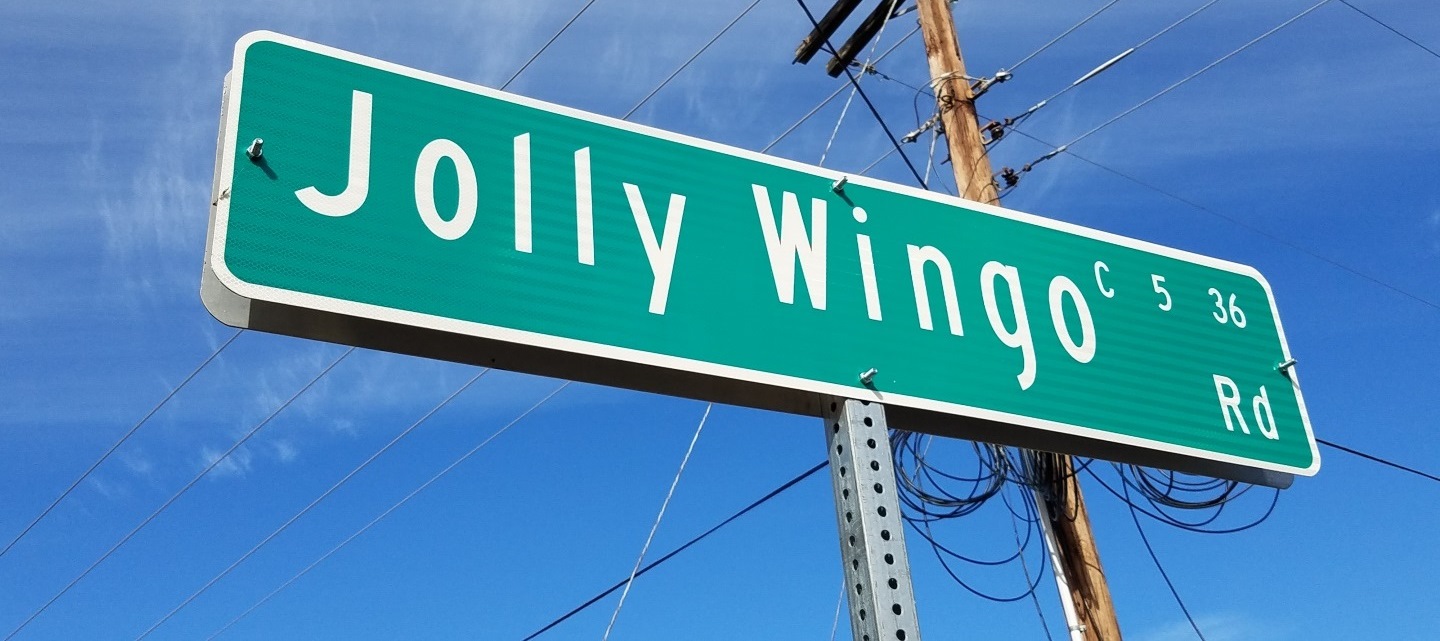 picture of a road sign that reads Jolly Wingo road