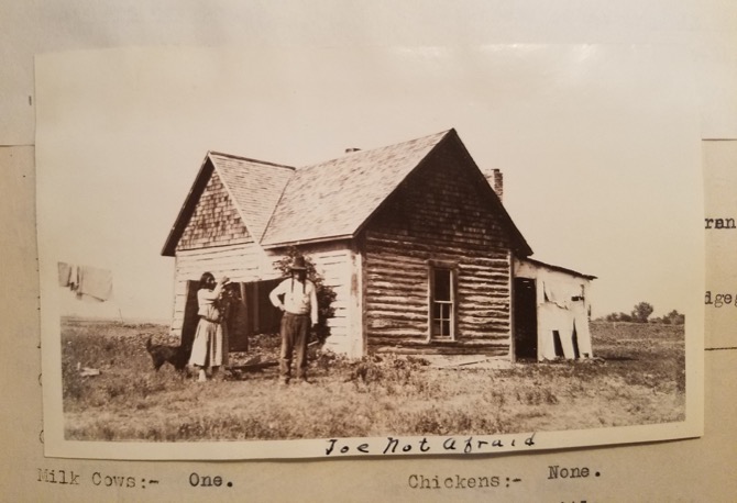image of a log house on the Crow Reservation