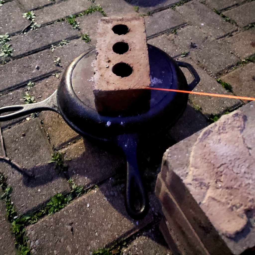 cast iron dutch over with brick on top
