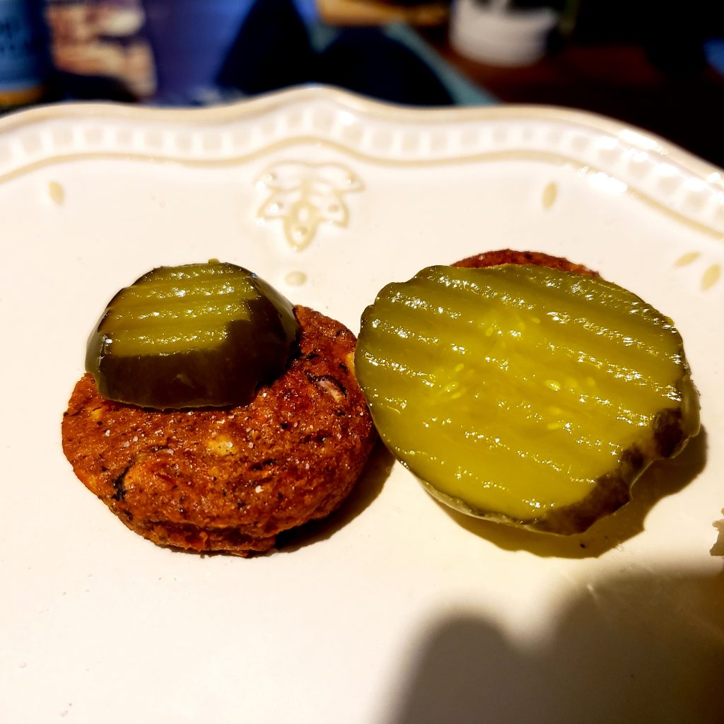 patties with pickles on it. they are the same size.