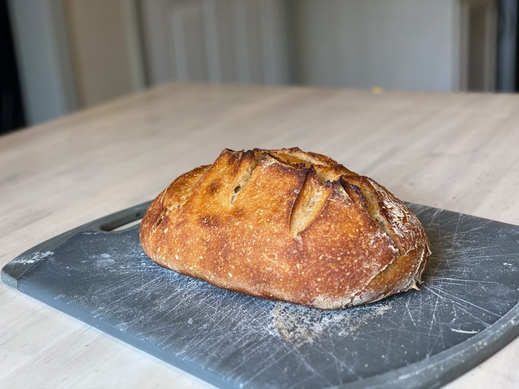 delicious baked sourdough on a cutting board