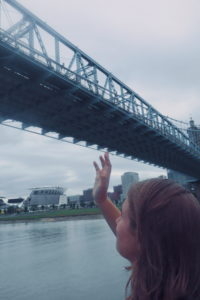 A picture of my sister and I going under the John A. Roebling Suspension Bridge on BB Riverboats. 