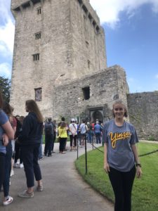 Girl standing in front of Castle and line