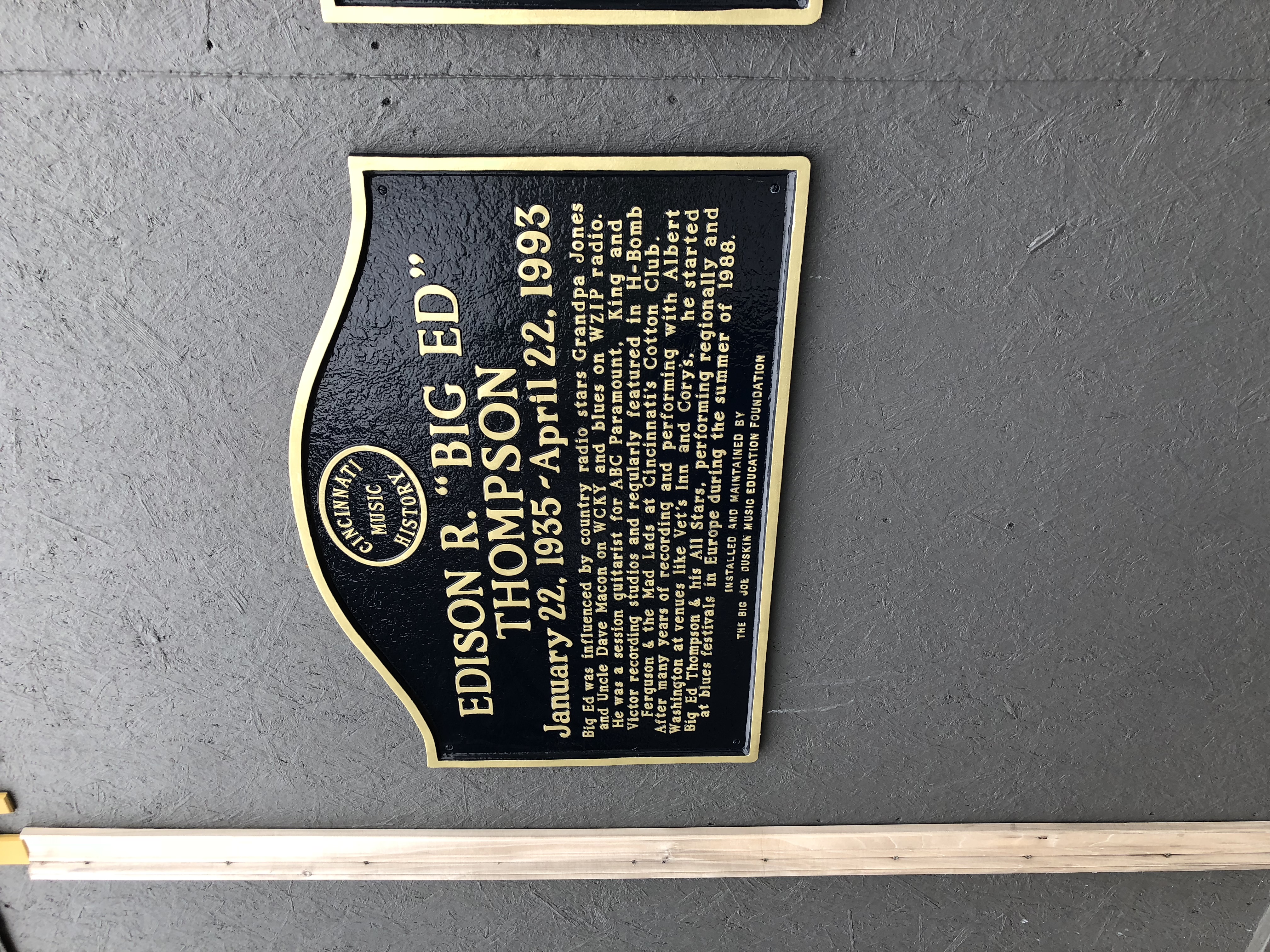 plaque on a grey wall