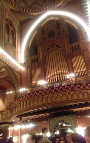 Photograph of inside Plum Street Temple; Cincinnati, OH. A large organ dominates the upper half of the photograph.