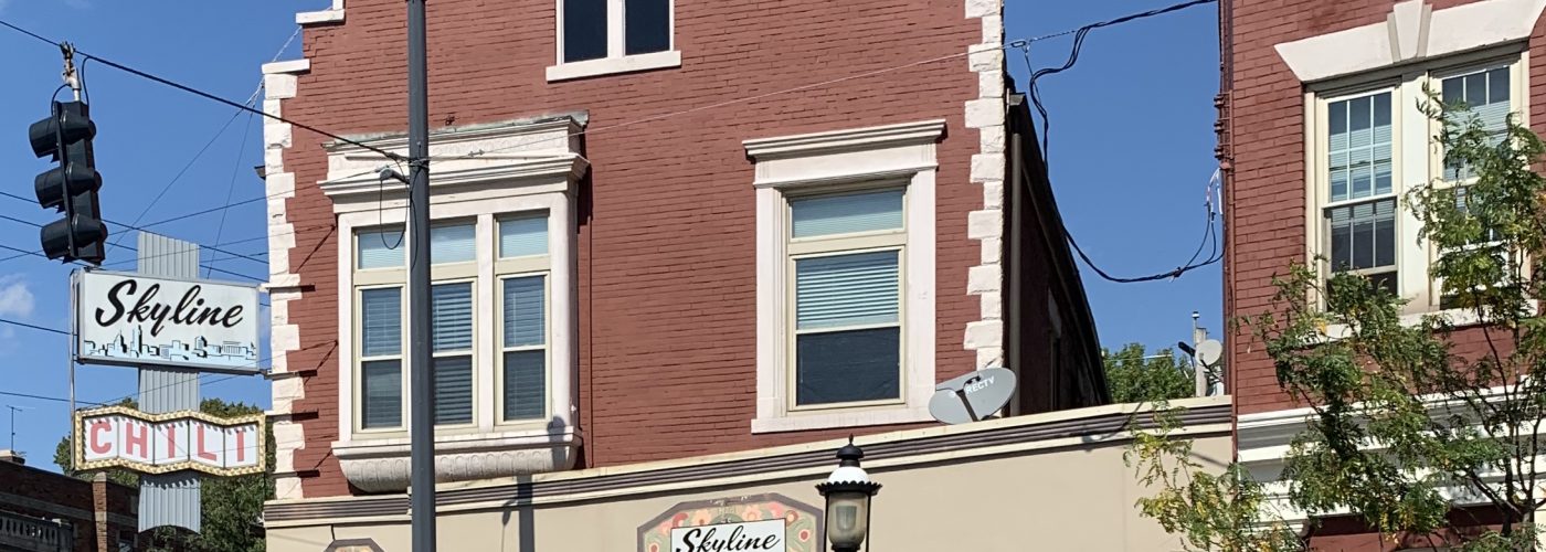 Red brick building with an old-fashioned sign that reads "Skyline Chili"