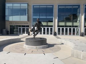 The nine foot tall Oscar Robertson statue standing outside of the Bearcats Fifth-Third Arena, his old stomping grounds, on a beautiful sunny day