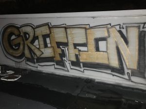 Graffiti on roof that says "Griffin"