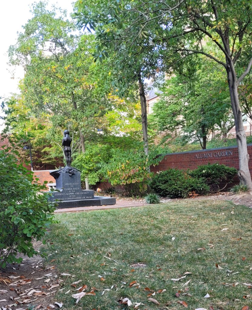 A wider view of the Alumni Garden surrounding the fountain seen from behind