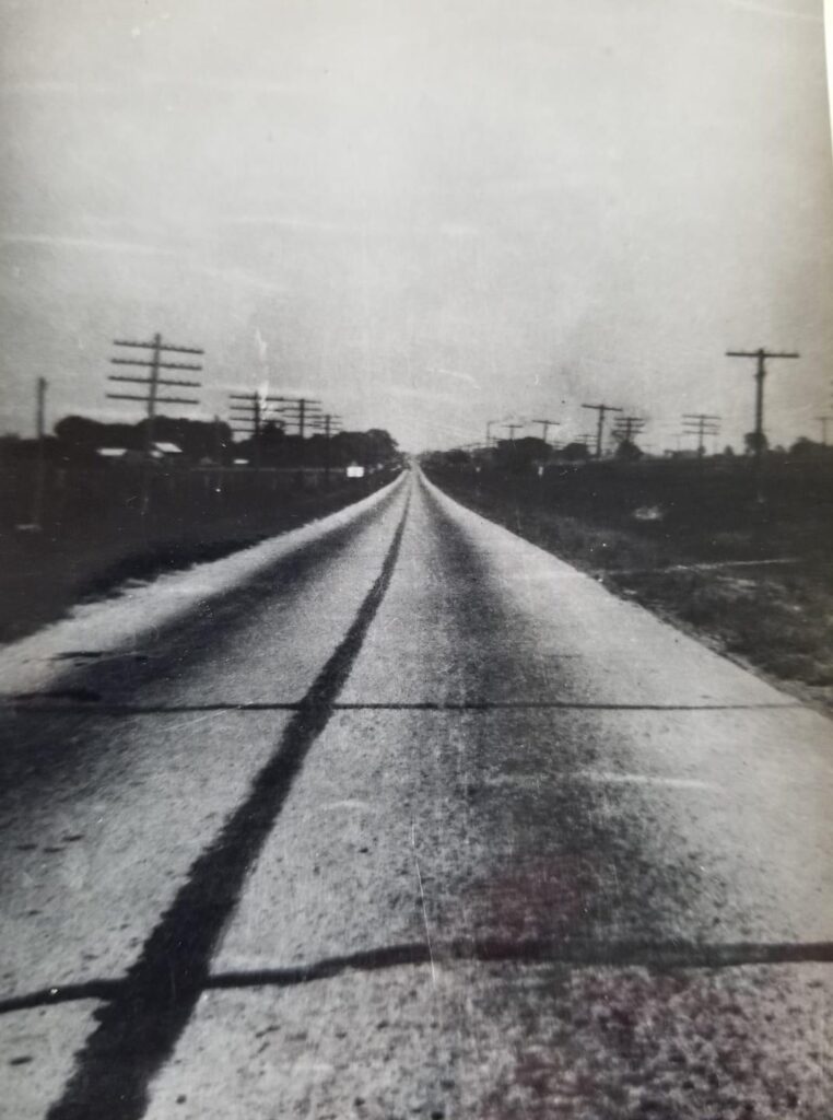 View down Beechmont Avenue Circa 1930, looking east toward 8 Mile Road. The image shows the original 2 lane configuration of Beechmont Avenue shortly after being paved, and the sparse development in the area.
