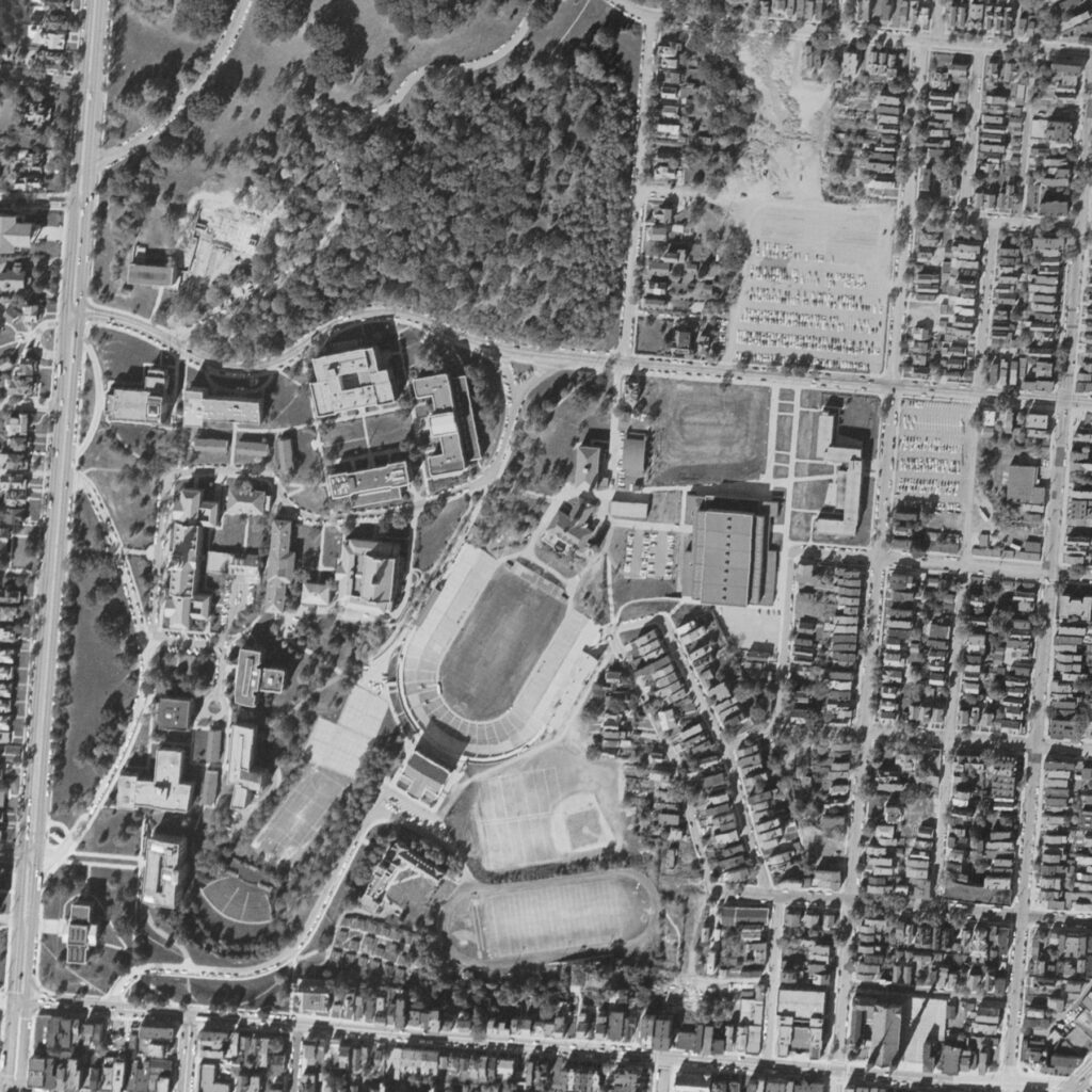 1956 Aerial photo showing the UC campus expanding eastward into Corryville, with the original northern boundary of W University Ave remaining intact. 