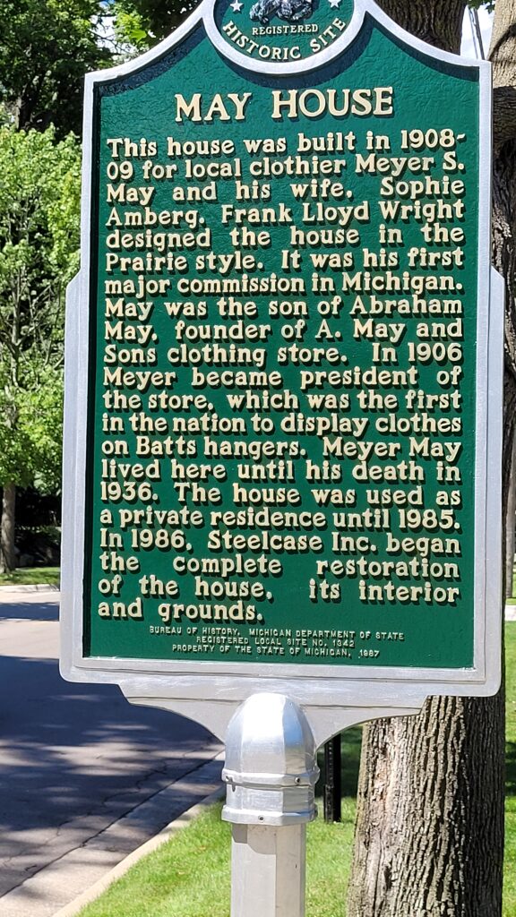 A historical marker stands outside the May House