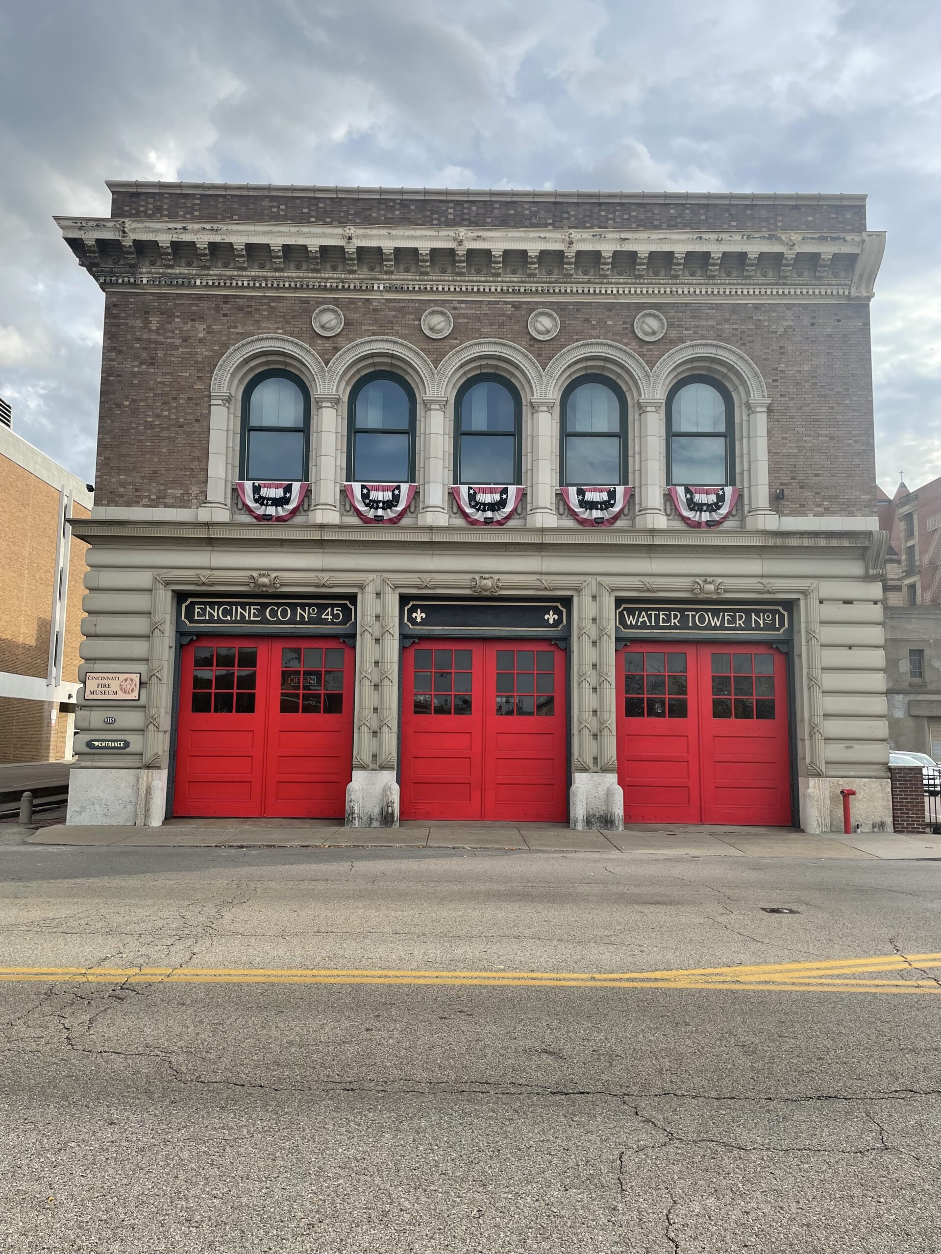 Front face of the Cincinnati Fire Museum, with its distinctive 3 red garage doors.