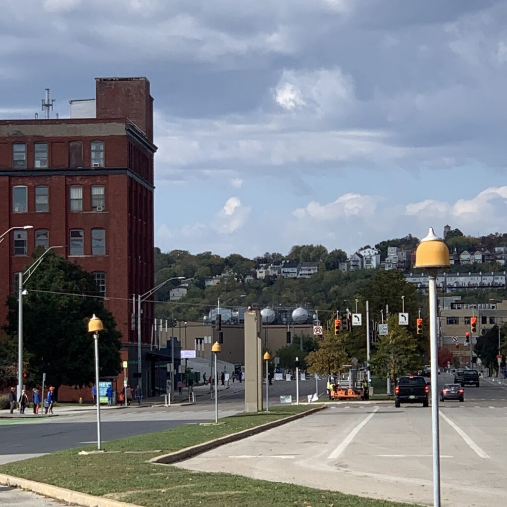 View looking north of yellow lamps lining Central Parkway's median, Fall 2023