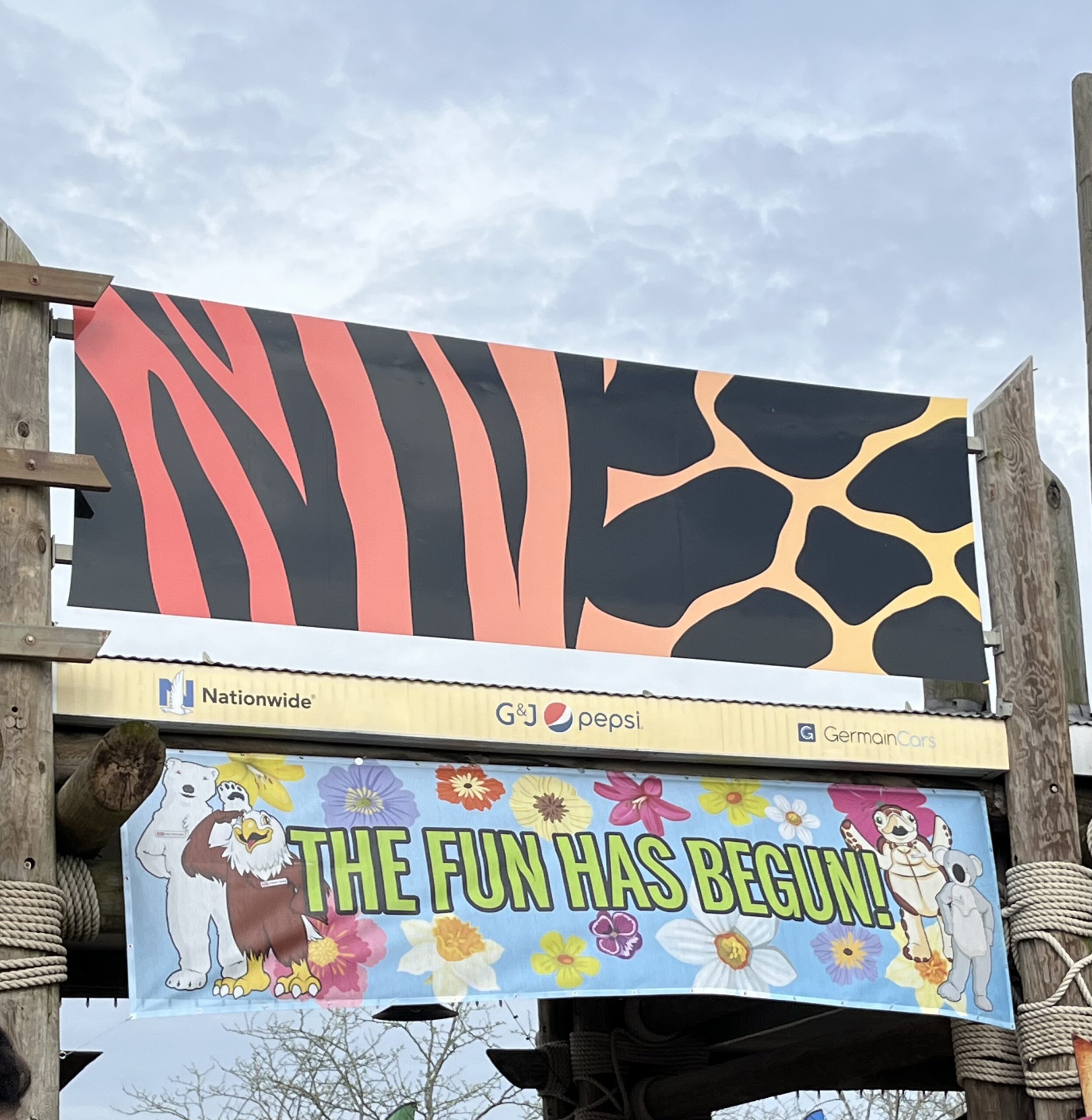 Banner at the front of the Columbus Zoo that says "The fun has begun!"
