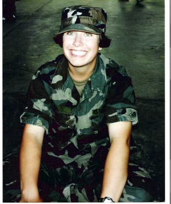 Photograph of Karen Dragon smiling wearing a camouflage army uniform