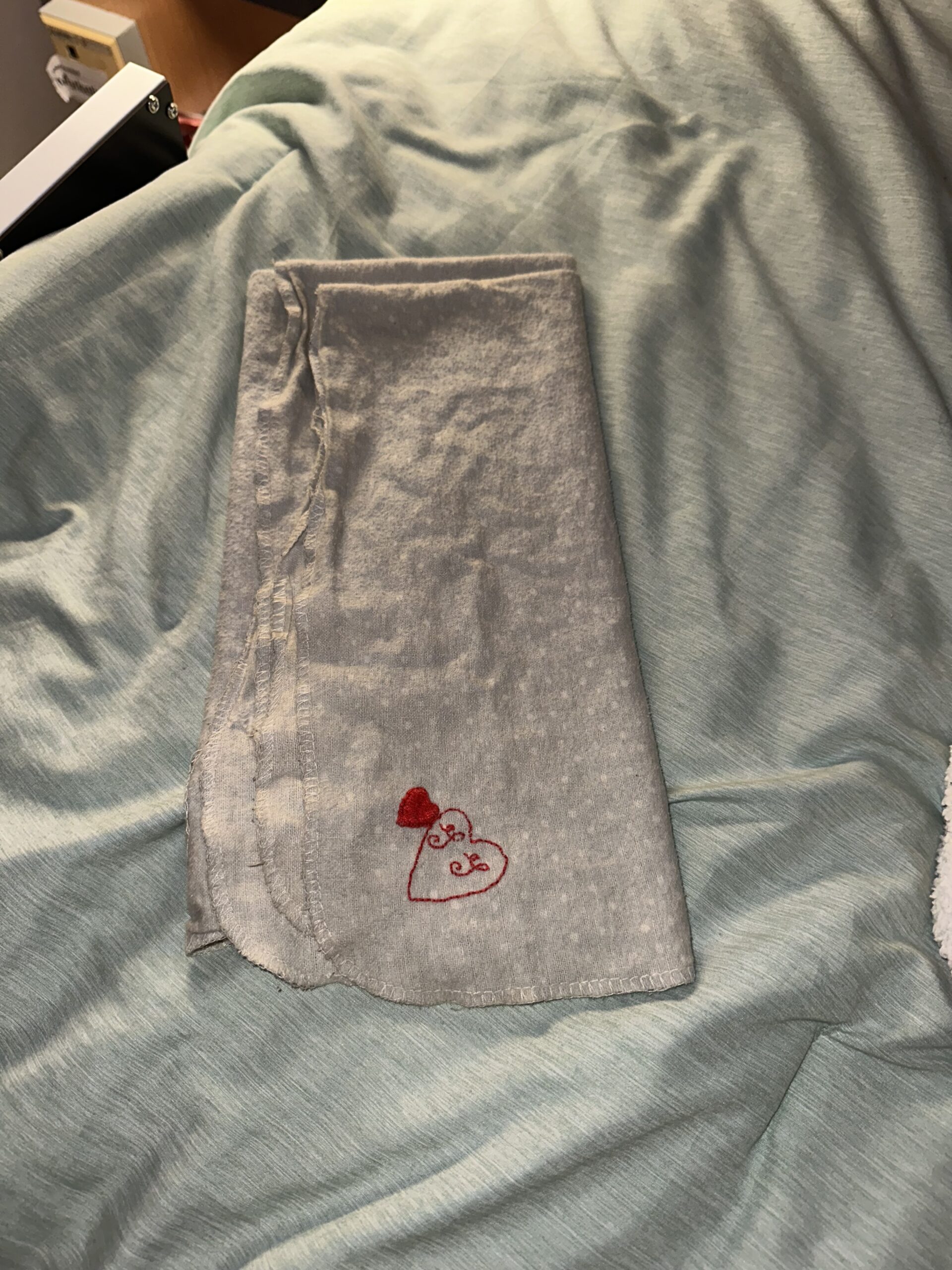 grey blanket with embroidery