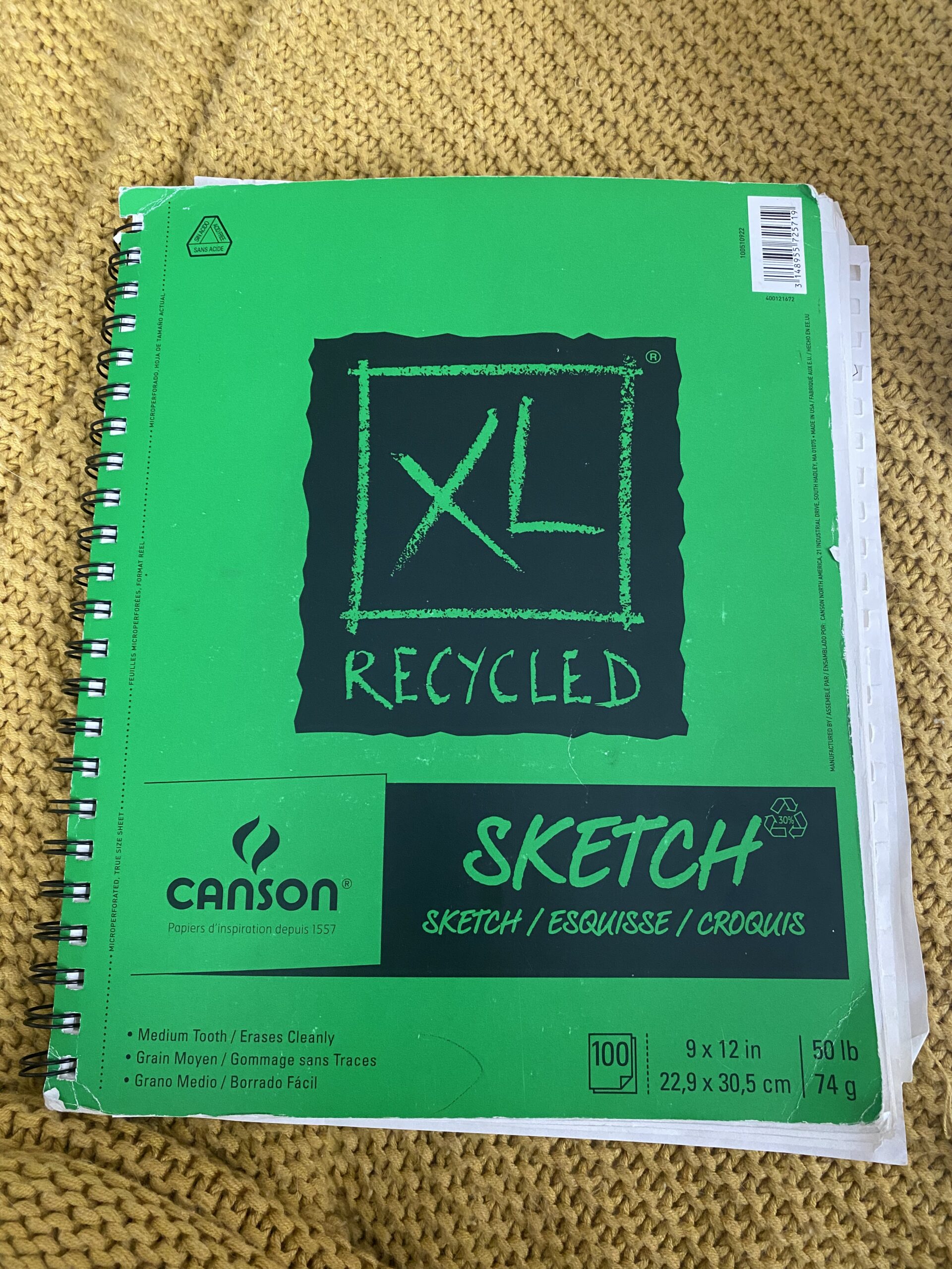 Front cover of Hannahs Sketchbook. It is green with black lettering