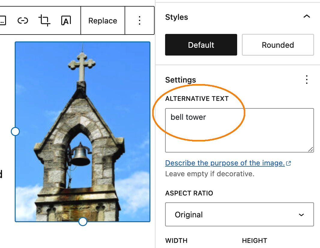 screenshot of a photo of a bell tower next to its alt text