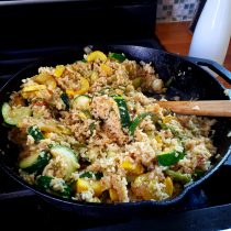 cast iron with fried rice and spoon